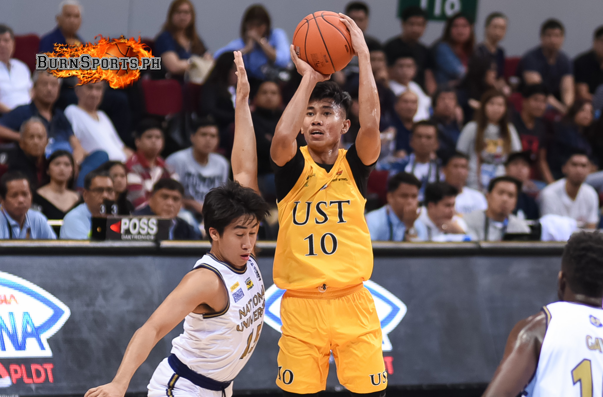 Abando delivers at crunch time as UST edges NU in OT thriller
