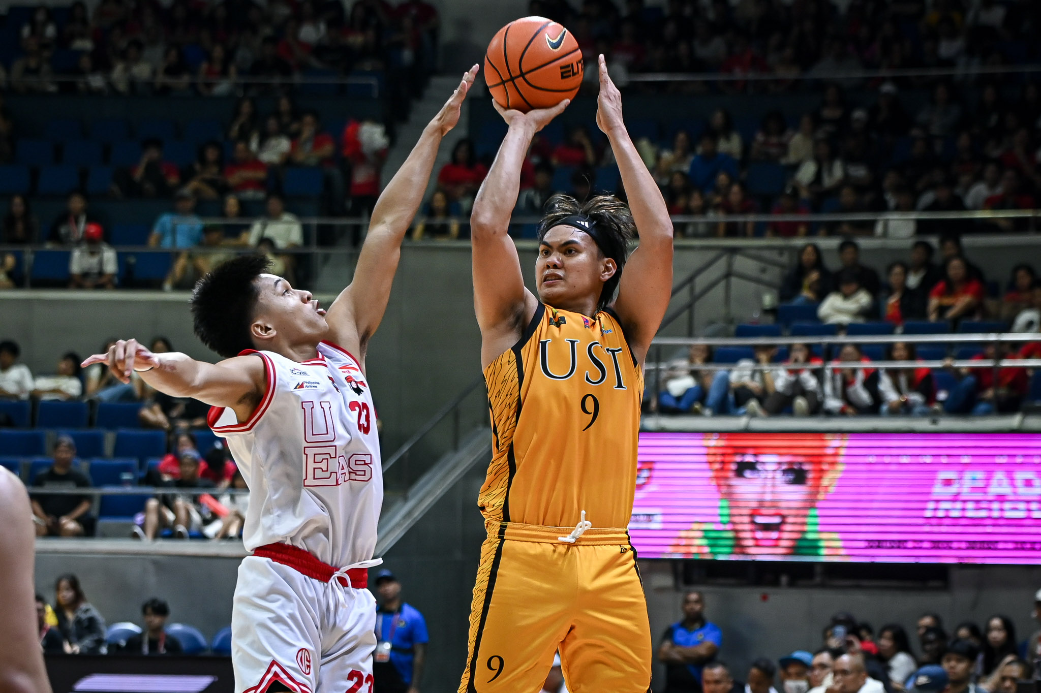 UST escapes late UE rally for solo 4th place